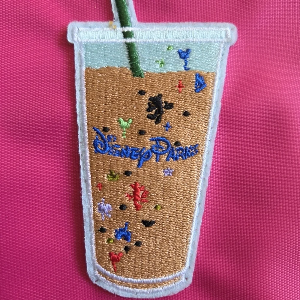 Pink Zipper Pouch with Embroidered Disney Design.